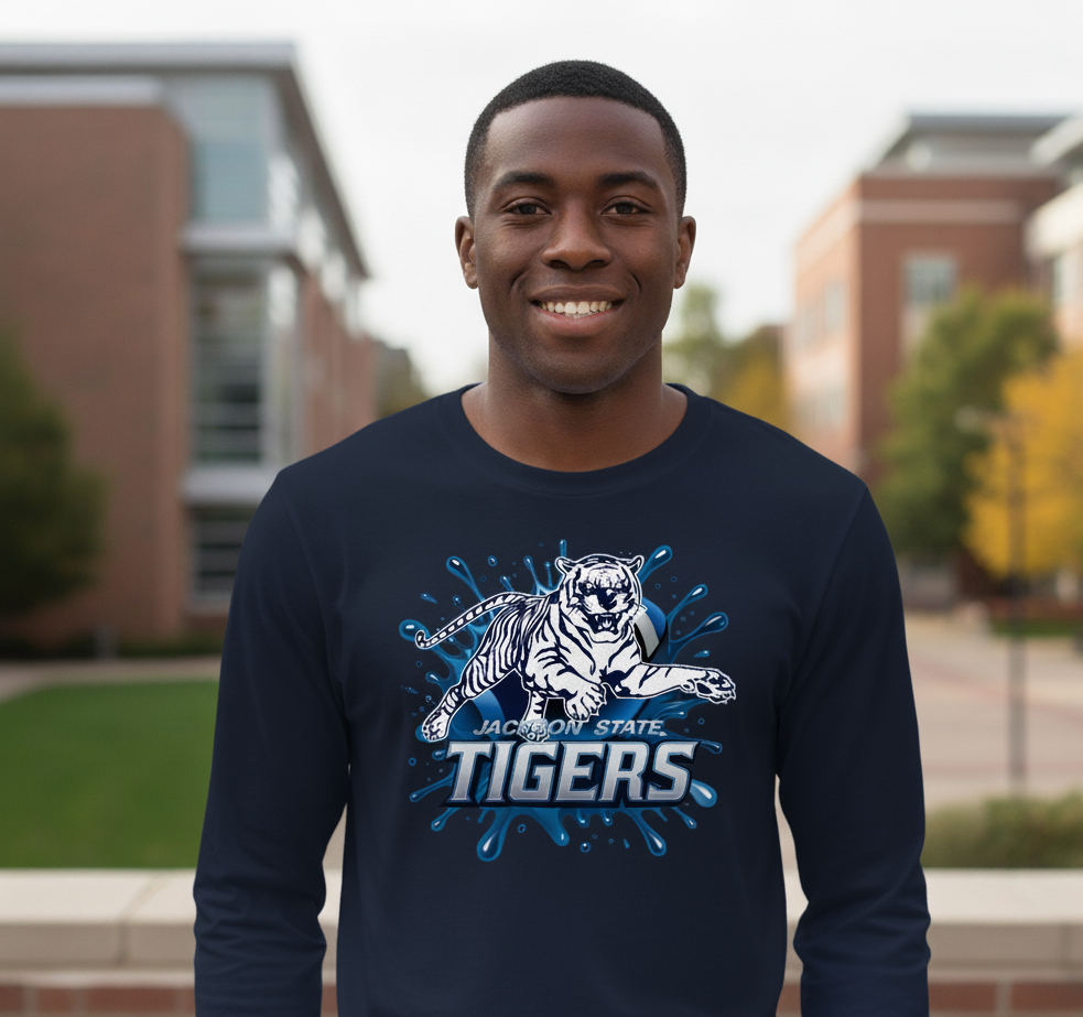 Black man wearing a Jackson State Blue Blitz Long Sleeve Navy Blue T-Shirt standing outdoors.