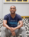 Man Sitting on Steps in Blue V-Neck JSU Authentic Streetwear T-Shirt