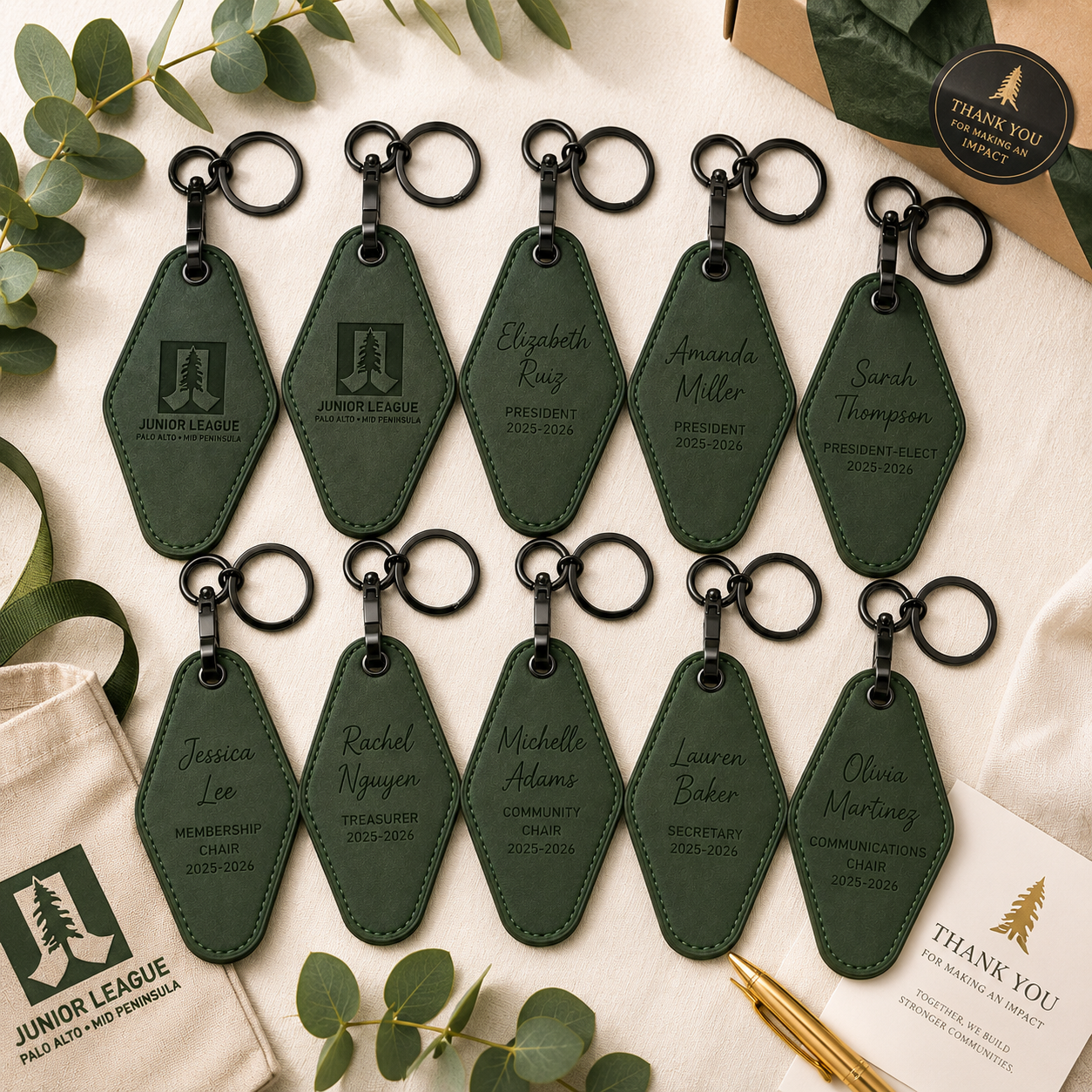 Bulk collection of personalized Junior League executive motel keychains with engraved officer titles and member names