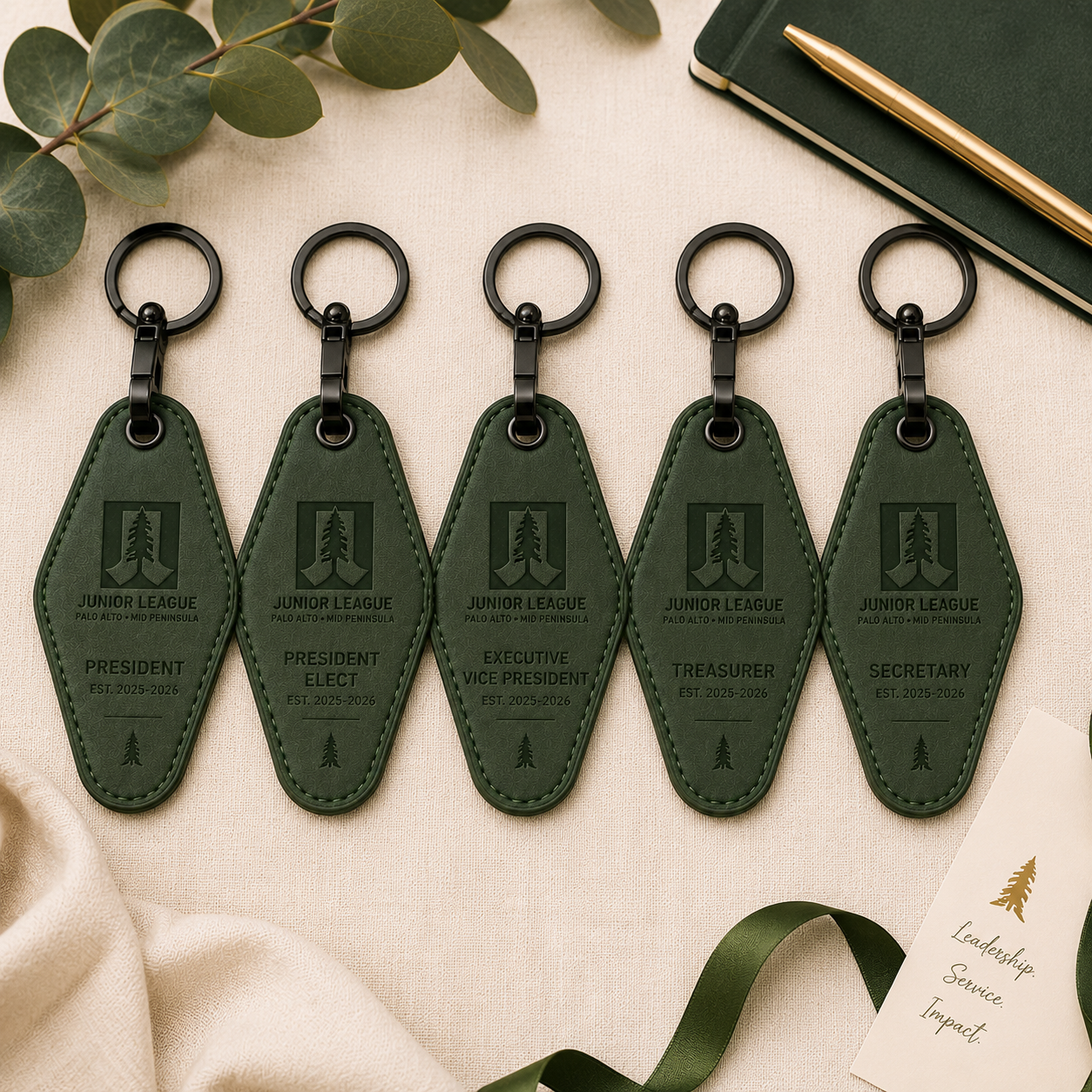 Executive officer collection of Junior League motel keychains engraved with leadership titles including president and secretary