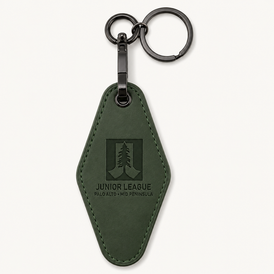 Junior League Palo Alto Mid Peninsula green laser engraved motel keychain with black gunmetal hardware on a clean neutral background