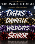 Personalized acrylic spirit stick with blue and white lettering plus red, purple, and gold pom-poms