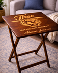 Dark wood folding tray table with engraved “J’thee,” tiger crest, and “John Michael Johnson”