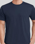 Navy blue t-shirt worn by a person on a light gray background