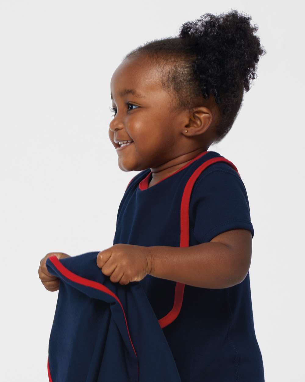 Navy blue baby bib with red trim and neck strap