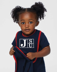 Infant bib on baby in navy blue with white JSU block letter logo