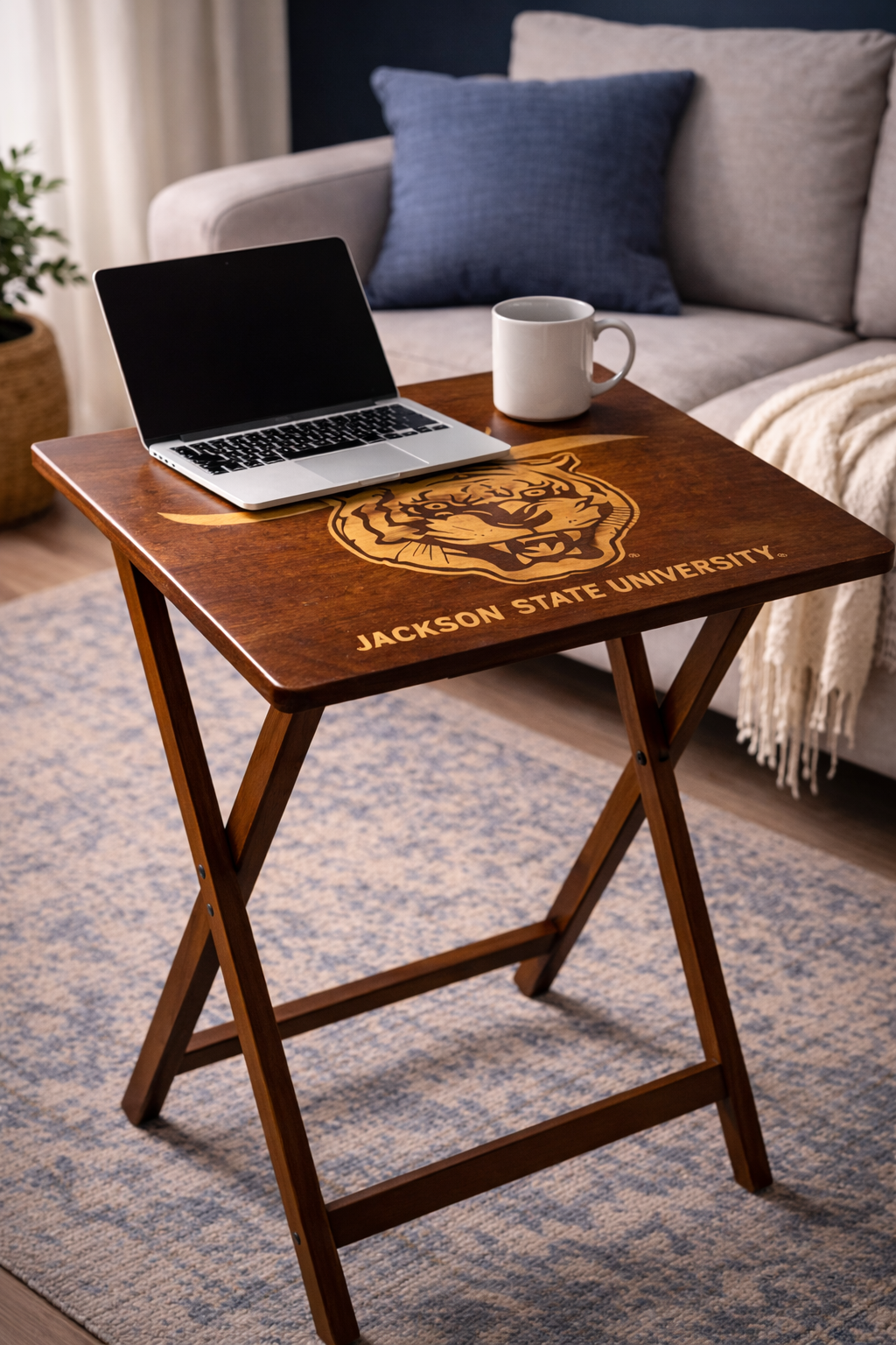 Dark wood folding tray table with engraved “J’thee” script and Jackson State University tiger crest