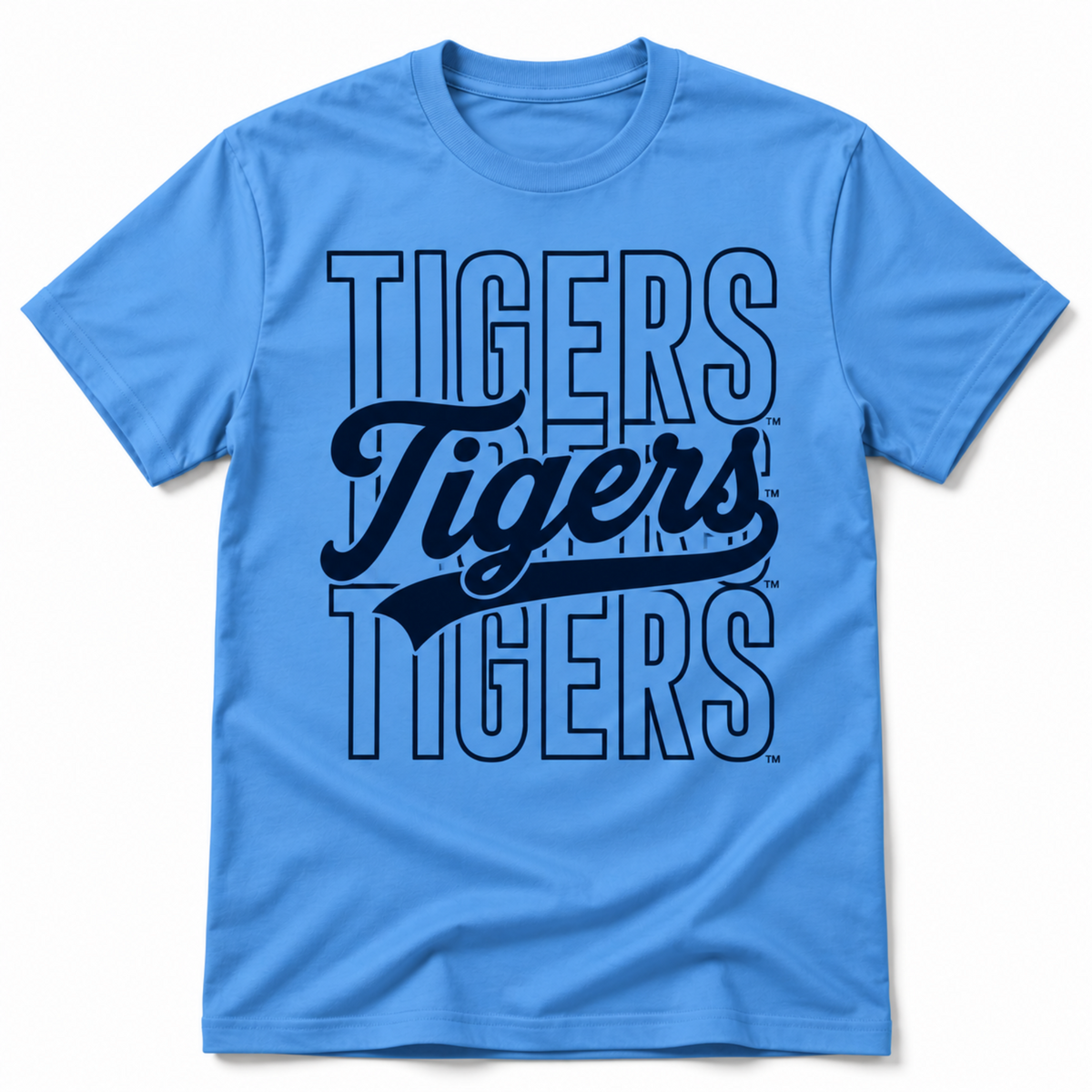 A light blue short-sleeve crewneck t-shirt featuring a large 'Tigers' graphic on the front, with 'TIGERS' in outlined block letters and 'Tigers' in a dark navy script font in the center.