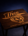 Dark walnut folding tray table with engraved “J’thee” and Jackson State University tiger crest