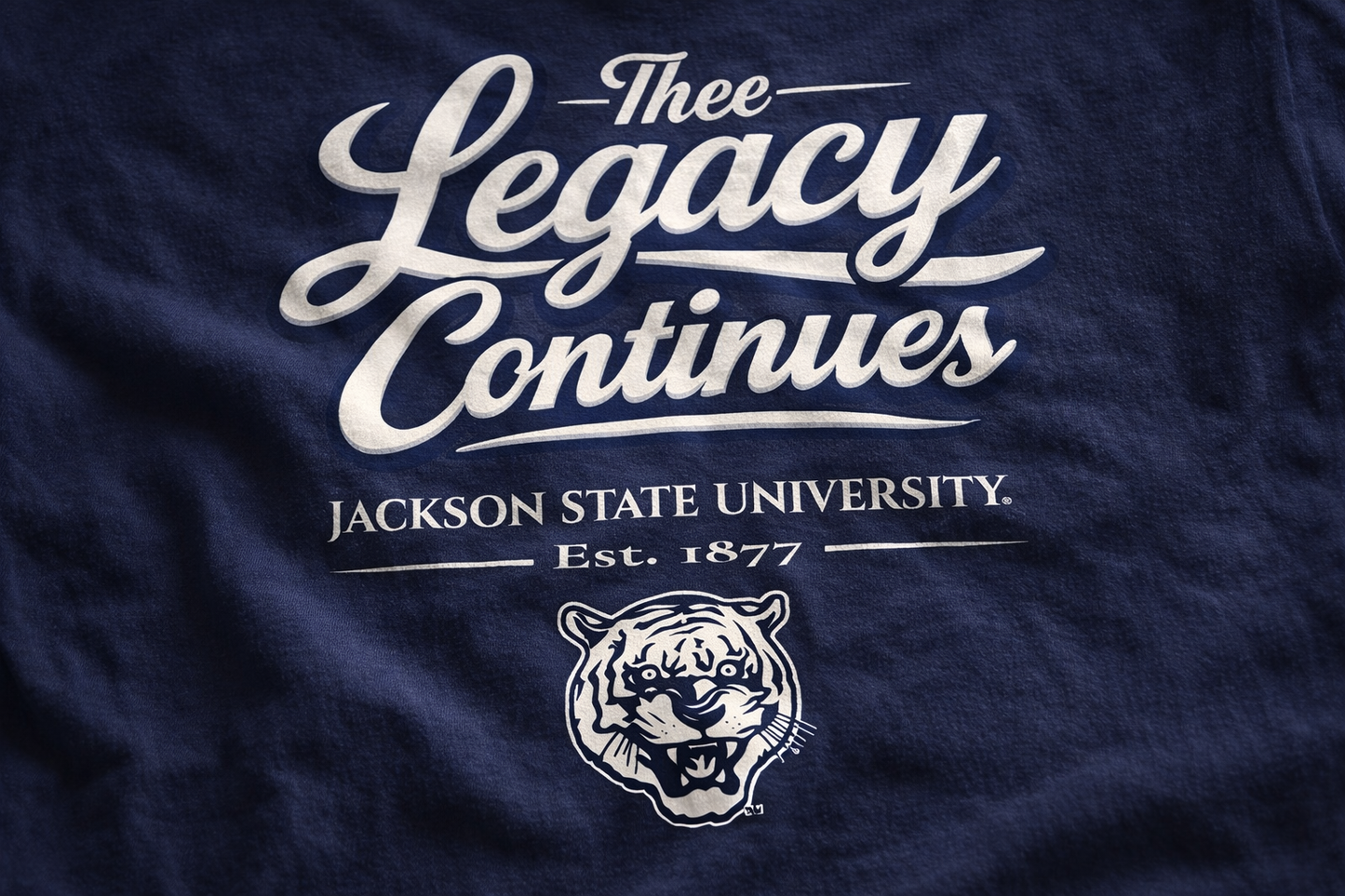 Navy blue t-shirt with 'Thee Legacy Continues' text and Jackson State University logo.