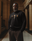 Black crewneck sweatshirt with three men portrait graphic on the chest