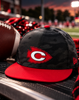 Clinton Arrows camo snapback cap with football game day setting