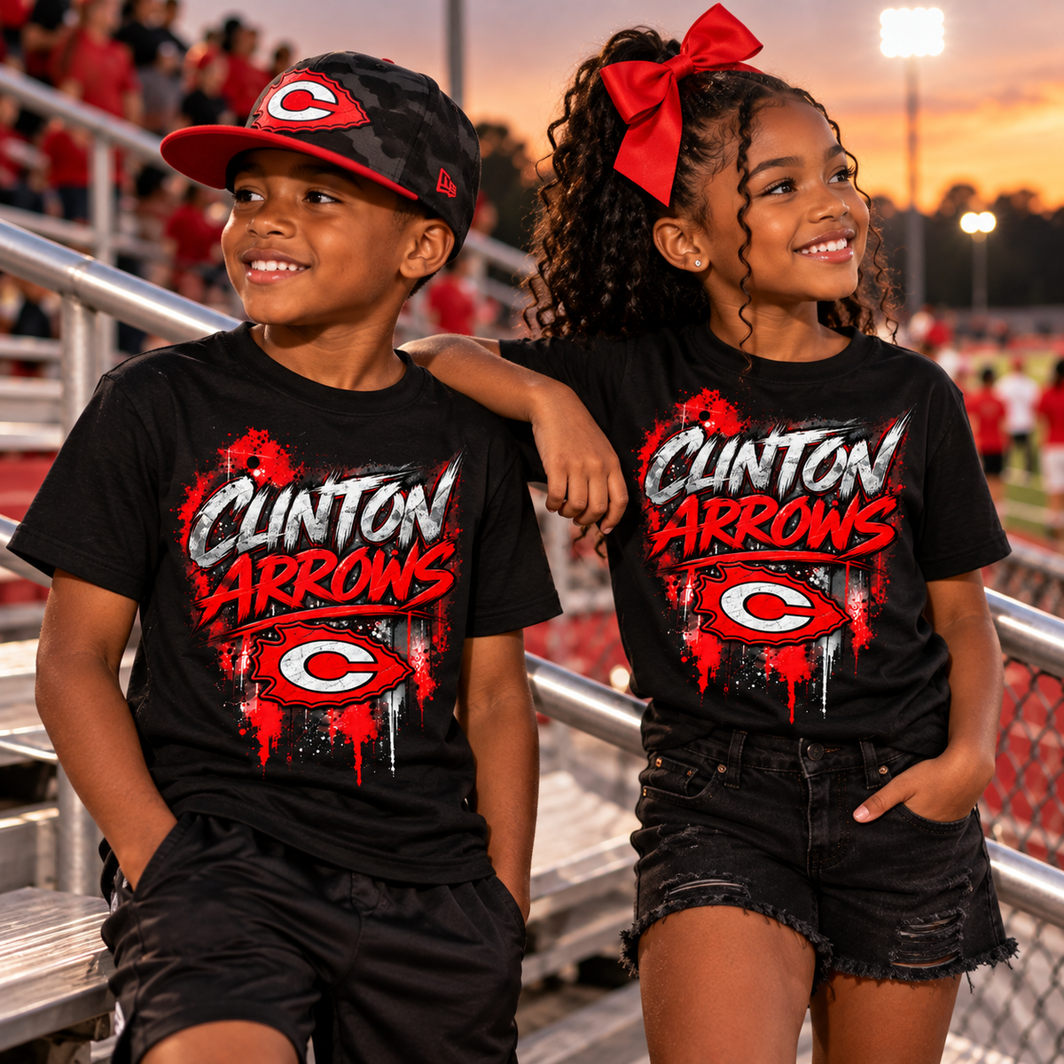 Youth models wearing black Clinton Arrows graffiti T-shirts at a football stadium