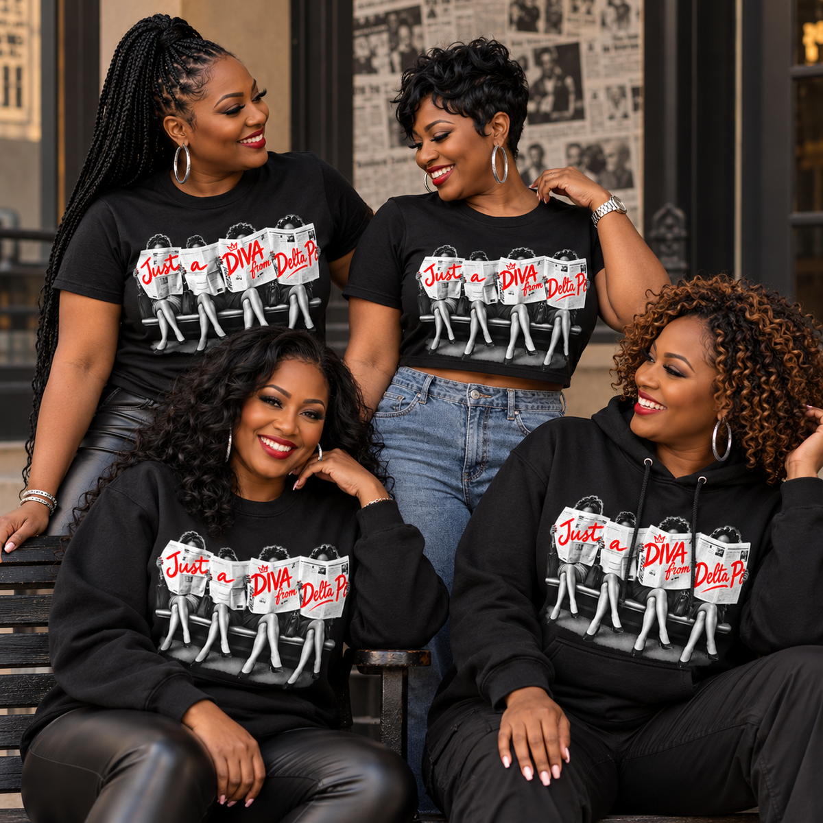 Four Black women wearing Just A Diva from Delta Pi black apparel in an editorial lifestyle setting