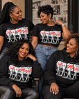 Four Black women wearing Just A Diva from Delta Pi black apparel in an editorial lifestyle setting