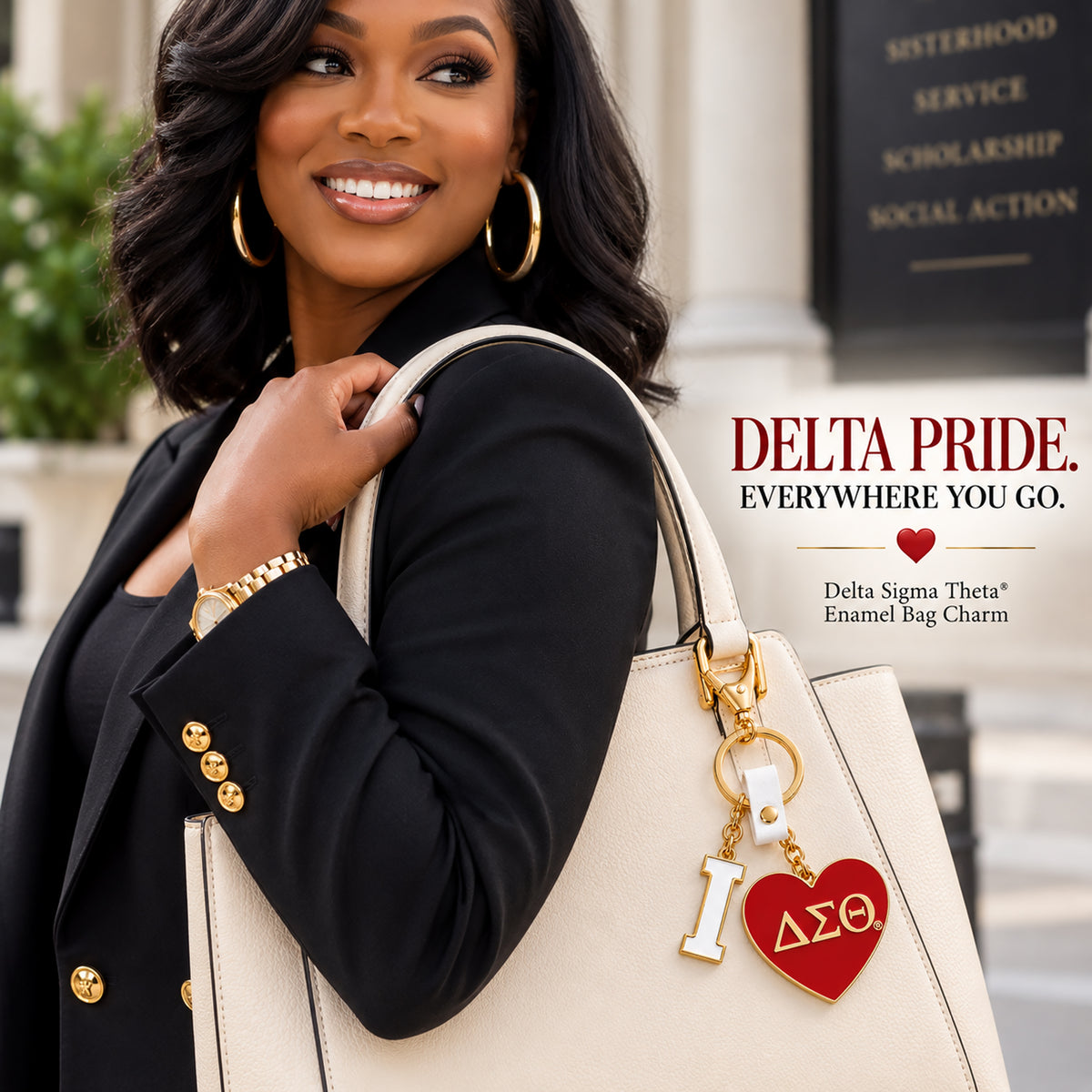 Stylish Black woman carrying a cream handbag featuring the Delta Sigma Theta I Heart DST enamel bag charm