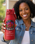 African American woman holding a personalized Crimson Frost Buddy Bottle Buddy featuring a Delta Sigma Theta 20th Deltaversary design.