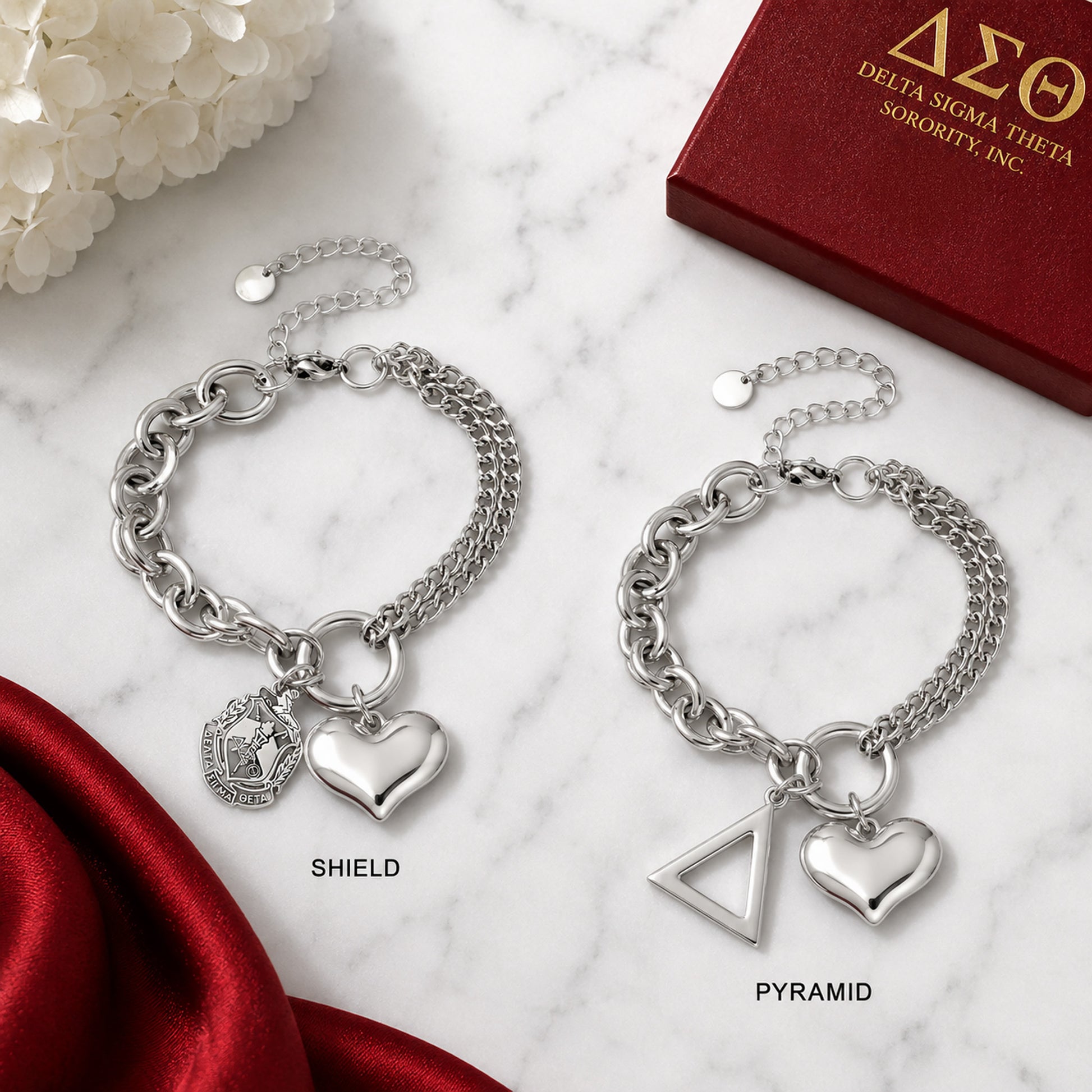 Comparison of Delta Sigma Theta bracelet available with official shield charm or pyramid charm.