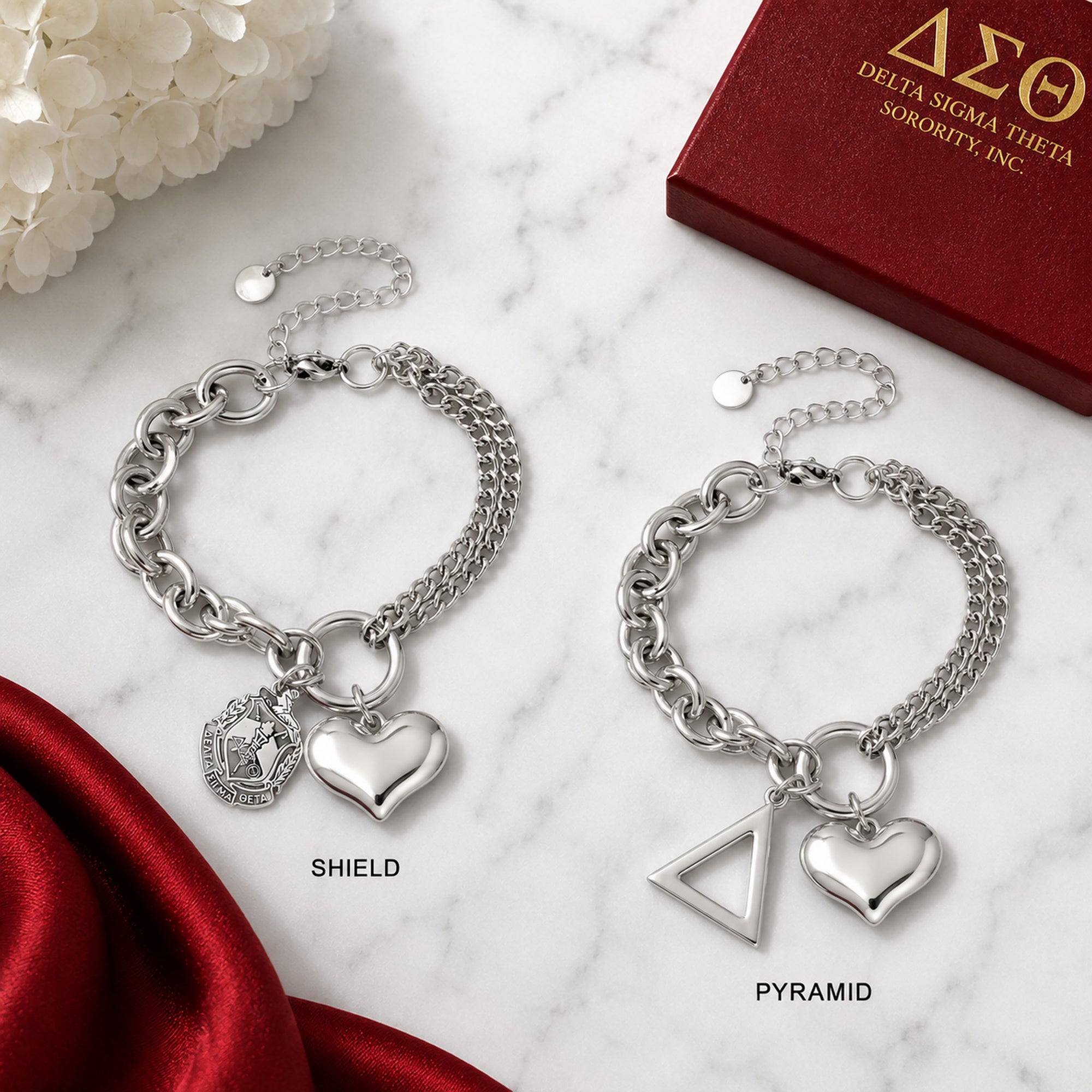 Comparison of Delta Sigma Theta bracelet available with official shield charm or pyramid charm.