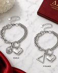 Comparison of Delta Sigma Theta bracelet available with official shield charm or pyramid charm.