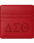 Front view of the Classic Crimson Delta Sigma Theta faux leather slim wallet with embossed Greek letters on a white background.