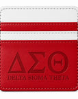 Front view of the Crimson & White Delta Sigma Theta faux leather slim wallet with embossed Greek letters on a white background.