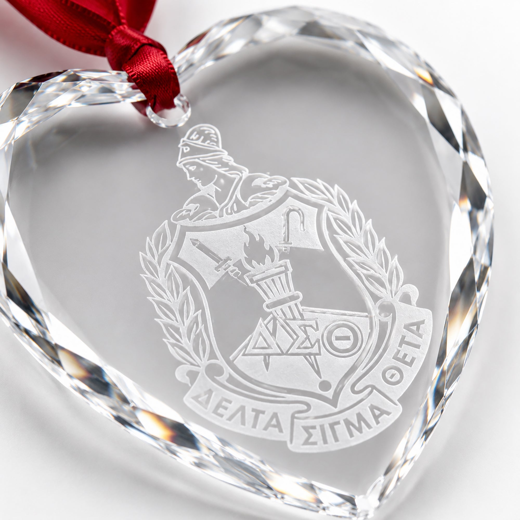 Close-up of precision laser engraving on crystal keepsake.