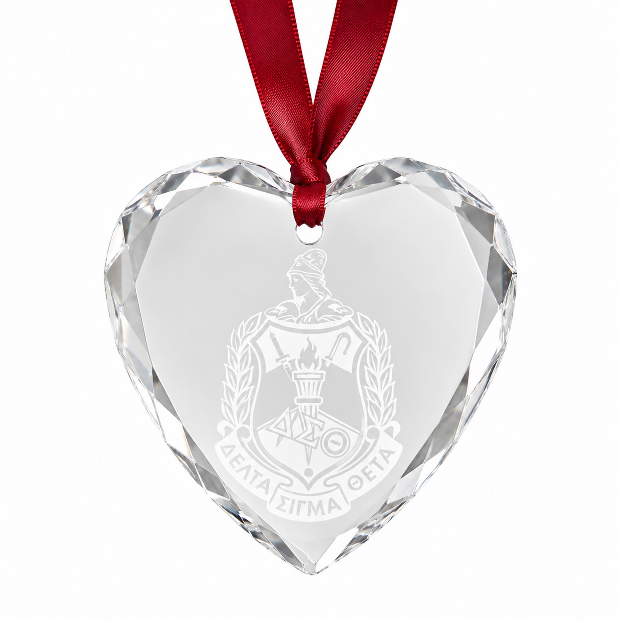 Officially licensed Delta Sigma Theta engraved crystal heart keepsake with shield design.