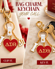 Delta Sigma Theta Delta Pi charm shown clipped to a cream handbag and used as a keychain with gold-tone hardware