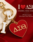 Delta Sigma Theta I Heart DST enamel bag charm displayed in a luxury crimson, ivory and gold setting