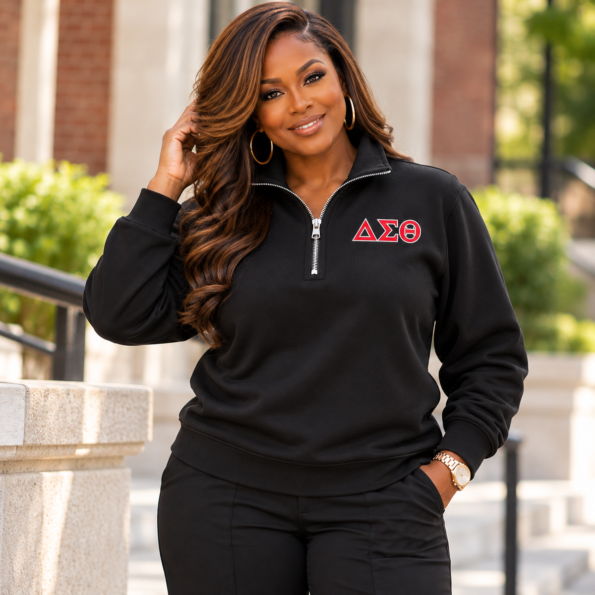 Black woman showing the blank back and fit of a black ladies Delta Sigma Theta quarter-zip sweatshirt