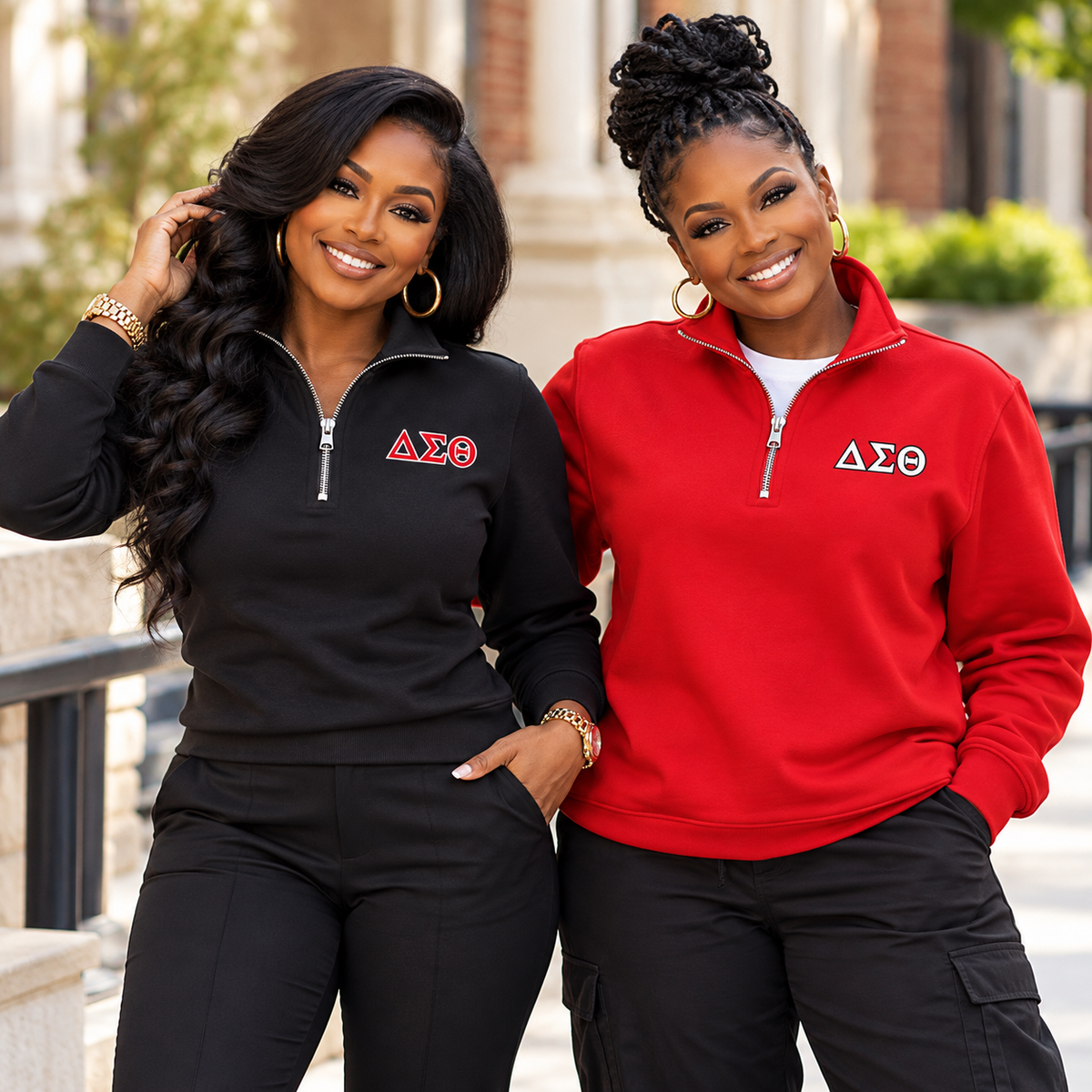 Two Black women modeling black and red Delta Sigma Theta quarter-zip sweatshirts