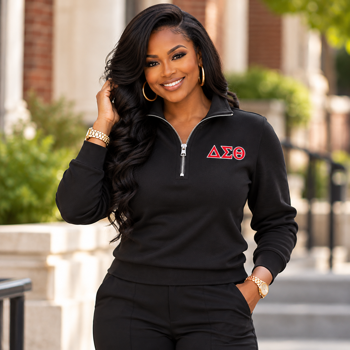 Black woman modeling a black ladies Delta Sigma Theta quarter-zip sweatshirt