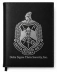 Black notebook with Delta Sigma Theta Sorority, Inc. emblem on a white background
