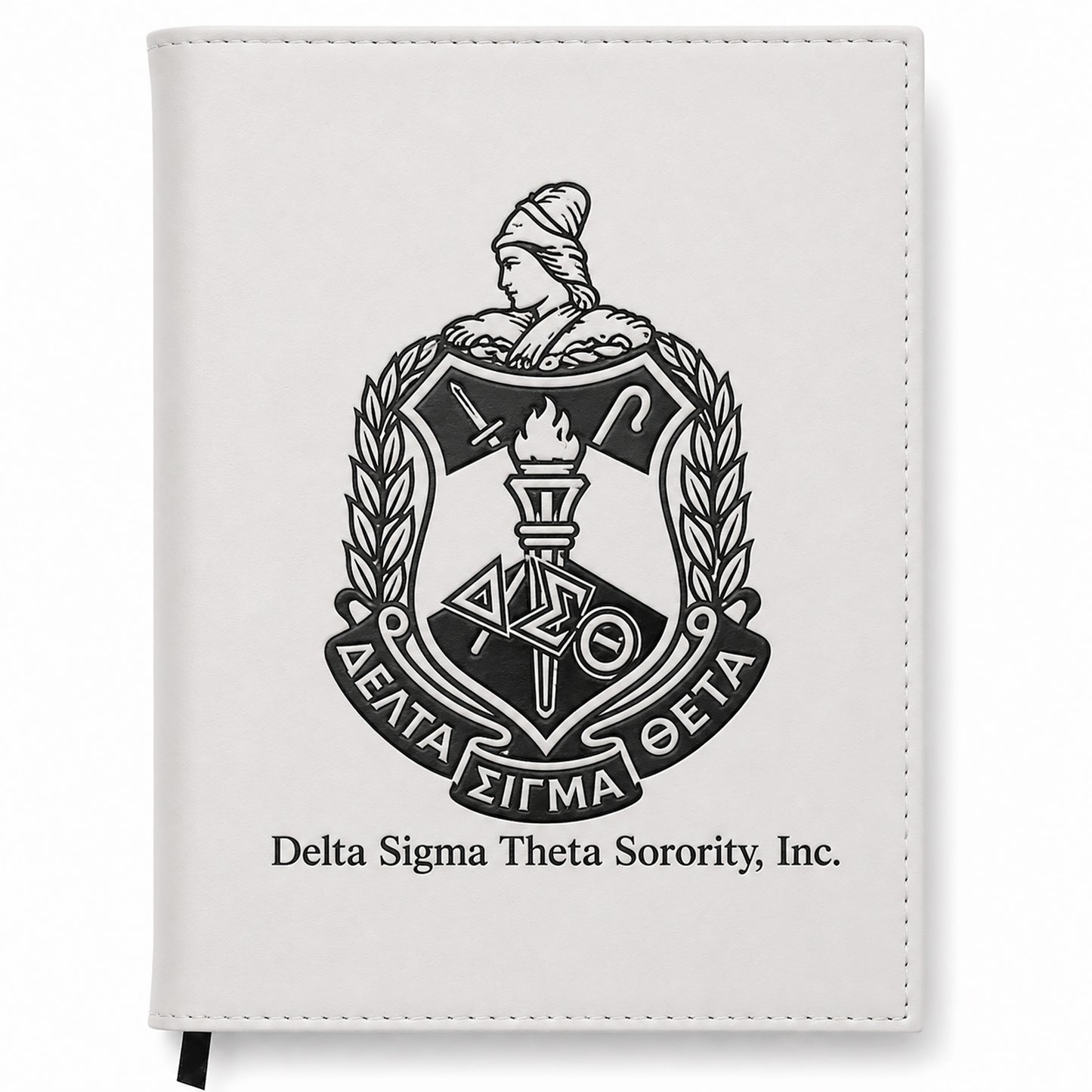 White notebook with Delta Sigma Theta Sorority, Inc. emblem on a white background