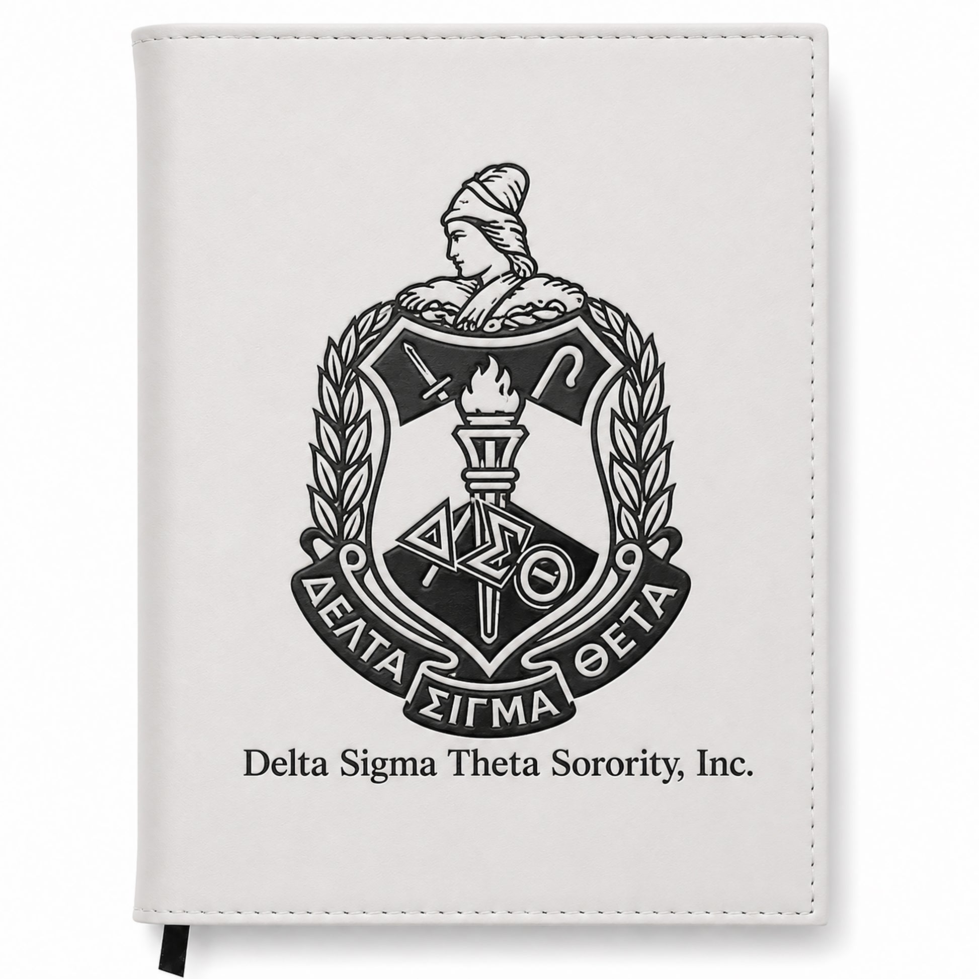 White notebook with Delta Sigma Theta Sorority, Inc. emblem on a white background