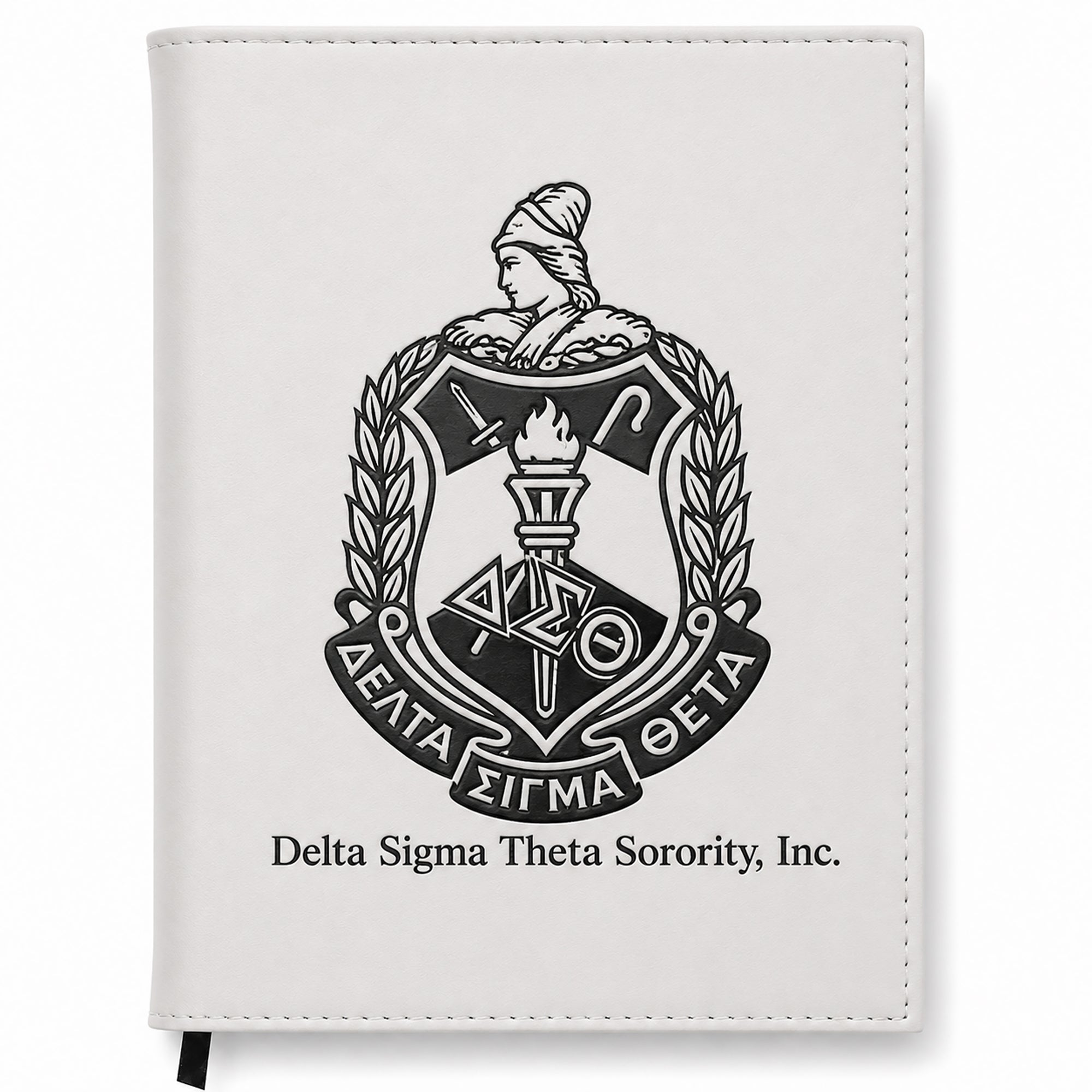 White notebook with Delta Sigma Theta Sorority, Inc. emblem on a white background