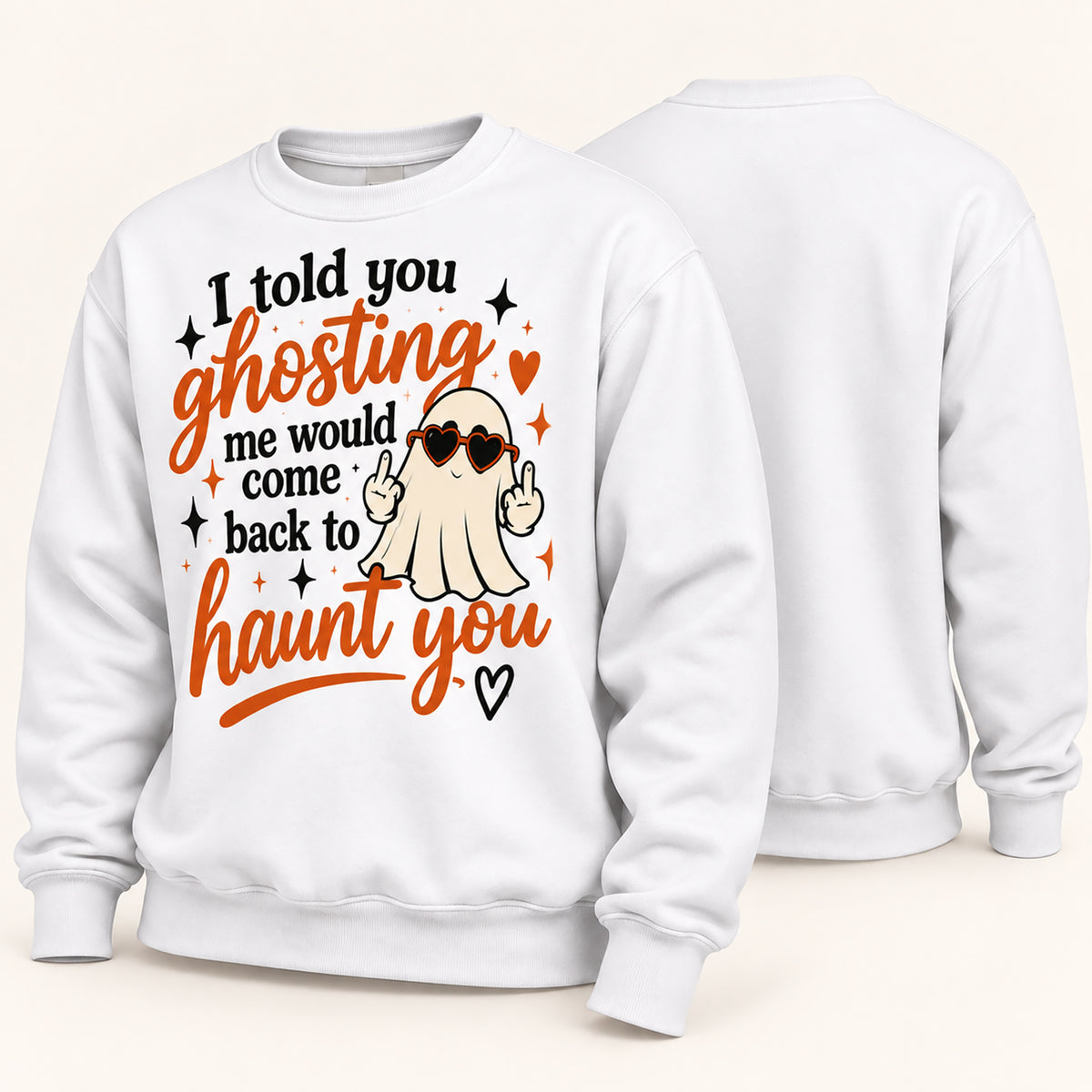 A white crewneck sweatshirt shown from both front and back. The front features a graphic design with the text 'I told you ghosting me would come back to haunt you' in black and orange lettering, alongside a cartoon ghost wearing heart-shaped sunglasses and making a peace sign.