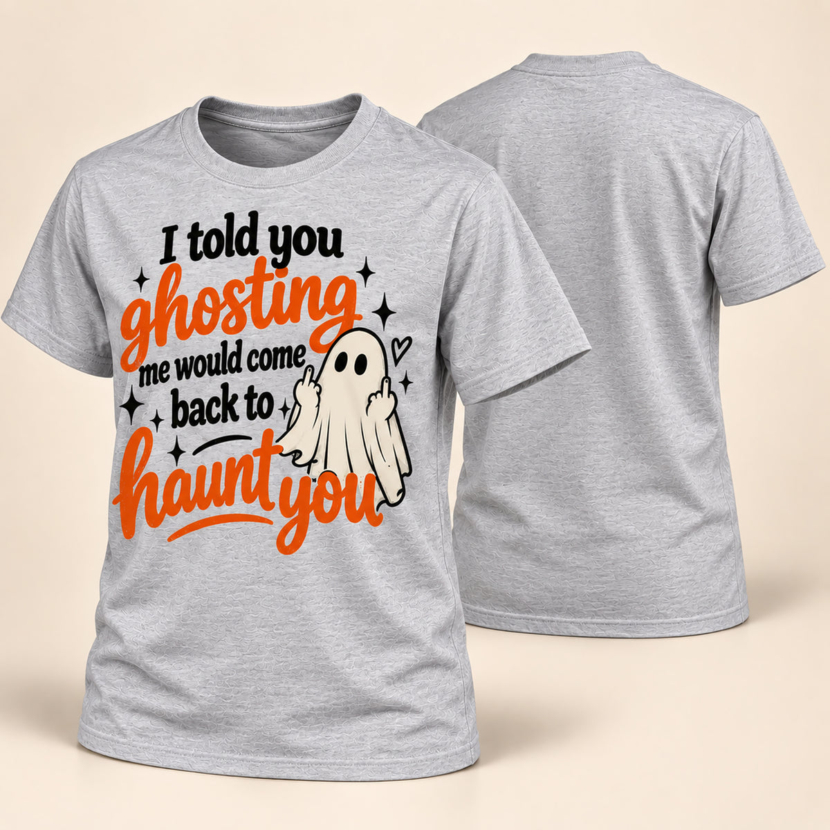 A heather gray short-sleeve t-shirt shown from both front and back. The front features a Halloween graphic with the text 'I told you ghosting me would come back to haunt you' in black and orange lettering, alongside a small white ghost illustration.