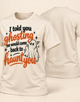 A cream-colored short-sleeve t-shirt shown from both the front and back. The front features a Halloween graphic with the text 'I told you ghosting me would come back to haunt you' in black and orange lettering, alongside a small white cartoon ghost.