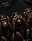 Close-up detail image of hear no evil see no evil speak no evil monkey graphic printed on black t-shirt
