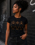 Black woman modeling fitted black graphic t-shirt featuring hear no evil see no evil speak no evil artwork