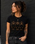 Woman wearing fitted black graphic t-shirt with hear no evil see no evil speak no evil monkey design