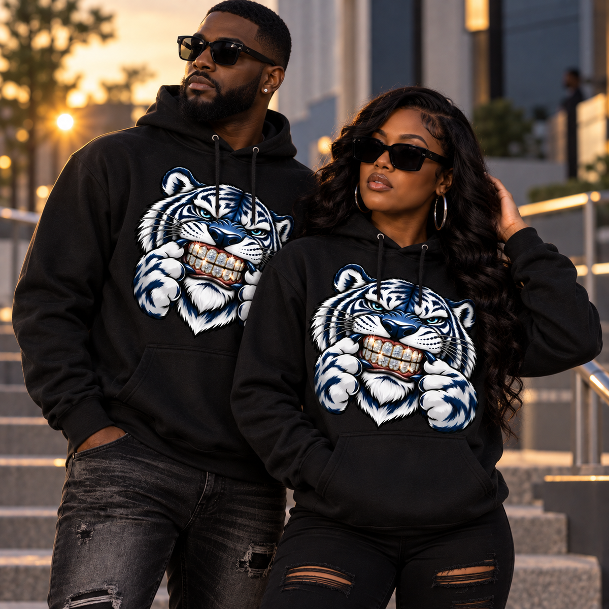 Black man and woman wearing Iced Out Tiger Bling black apparel
