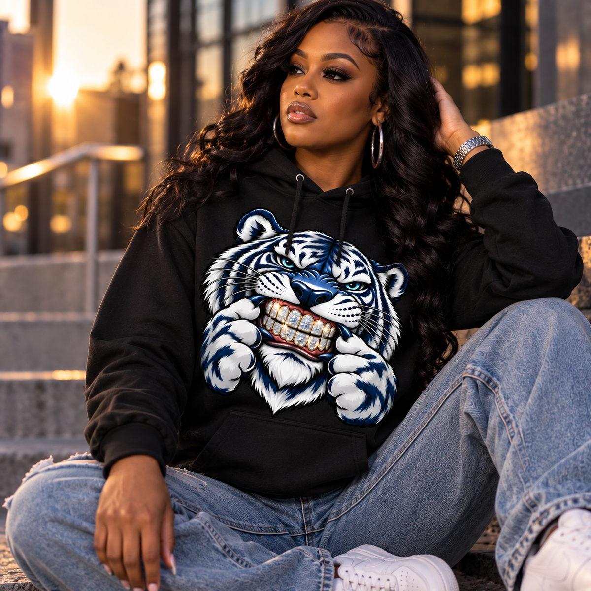 Black woman wearing Iced Out Tiger Bling black pullover hoodie