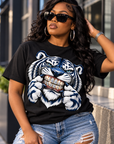 Black woman wearing Iced Out Tiger Bling black T-shirt