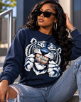 Black woman wearing navy Iced Out Tiger Bling crewneck sweatshirt