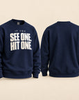 A navy blue crewneck sweatshirt shown from both the front and back. The front features the slogan 'IF YOU SEE ONE, HIT ONE.