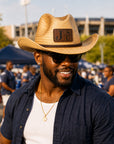 Jackson State University fan wearing JSU cowboy straw hat on game day