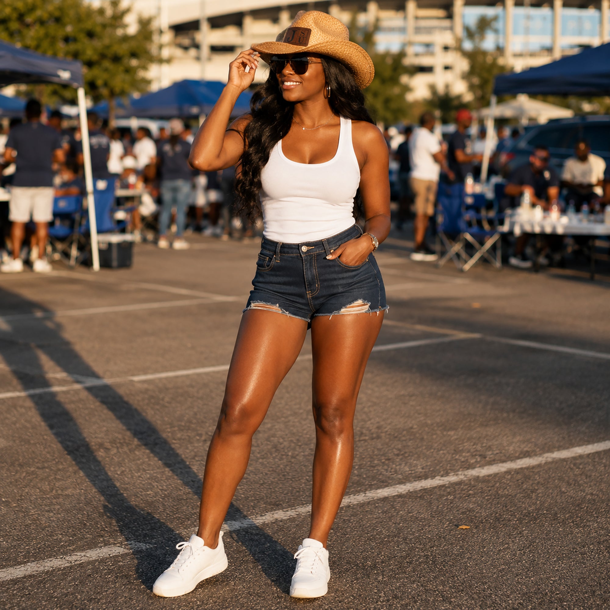 Jackson State University female fan wearing JSU cowboy straw hat on game day